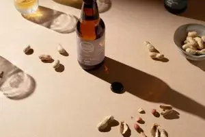 bottle of beer buddy with peanuts